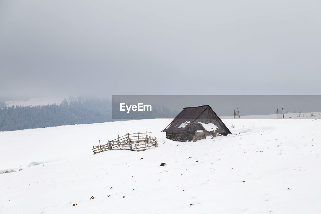 Scenic view of snow field against sky