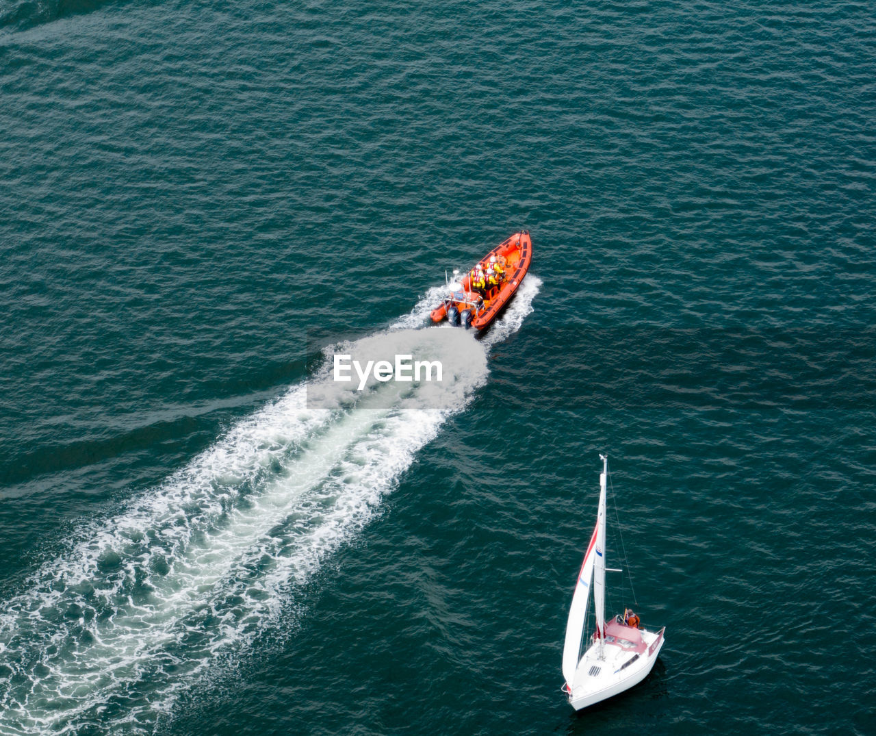 water, nautical vessel, transportation, mode of transportation, high angle view, sea, sailing, motion, wake, wave pattern, nature, sports, boat, vehicle, day, boating, on the move, speed, water sports, outdoors, men, ship, travel, watercraft, beauty in nature, wind, waterfront, adventure, aerial view, leisure activity, lifestyles, wind wave, wave, powerboating, extreme sports