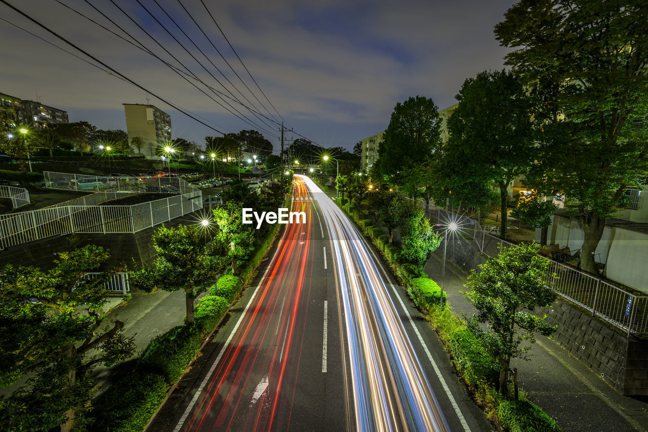 High angle view of light trails on road in city