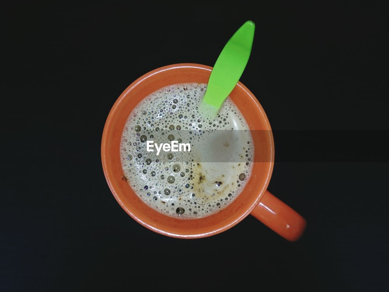 CLOSE-UP OF COFFEE CUP ON TABLE