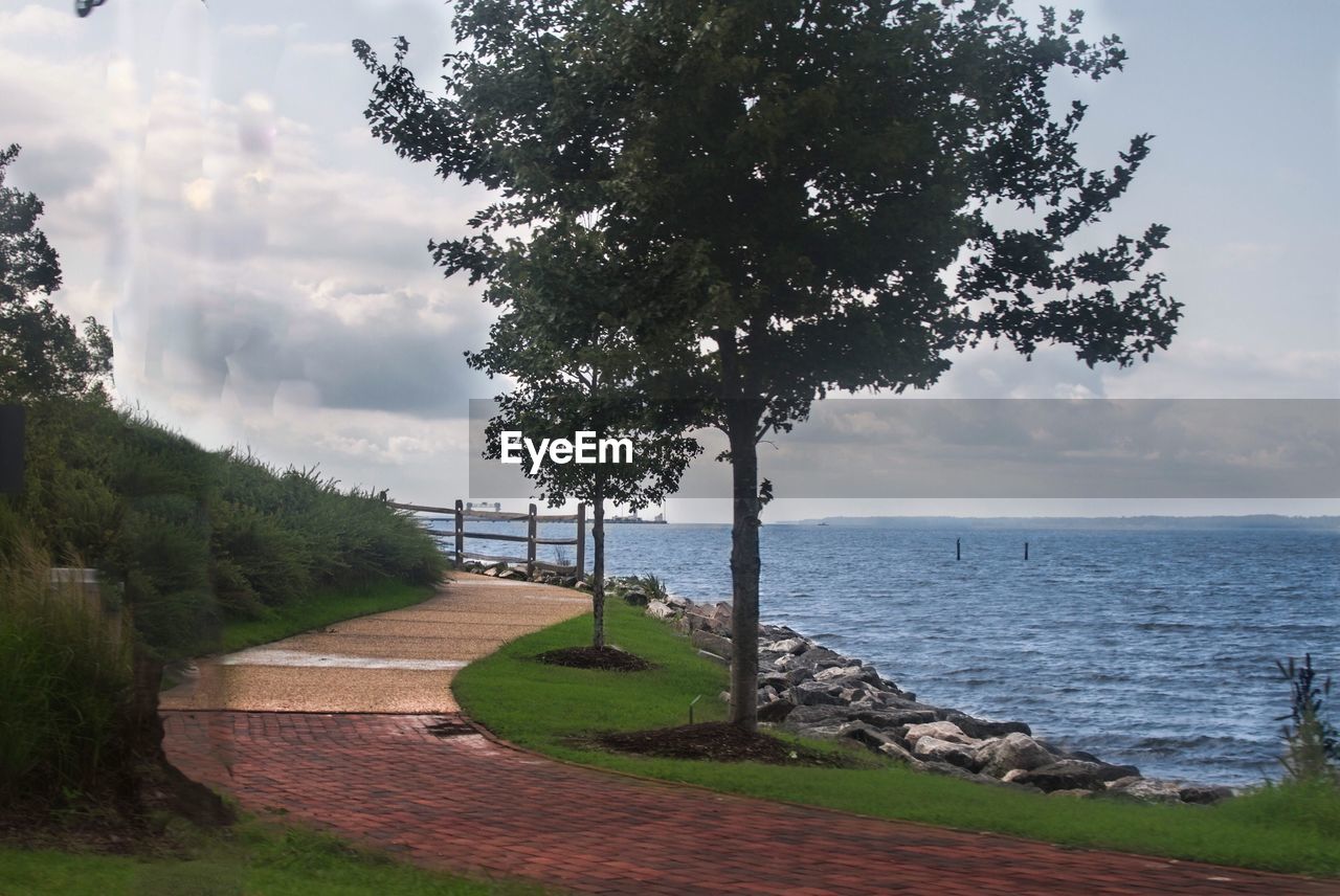 Scenic view of landscape against cloudy sky