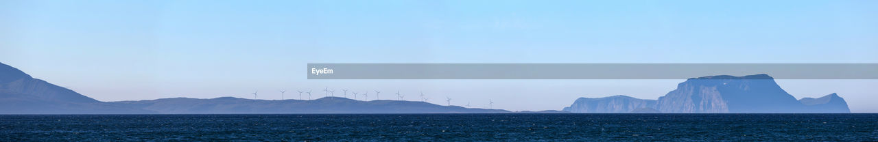 Sea with mountain in background