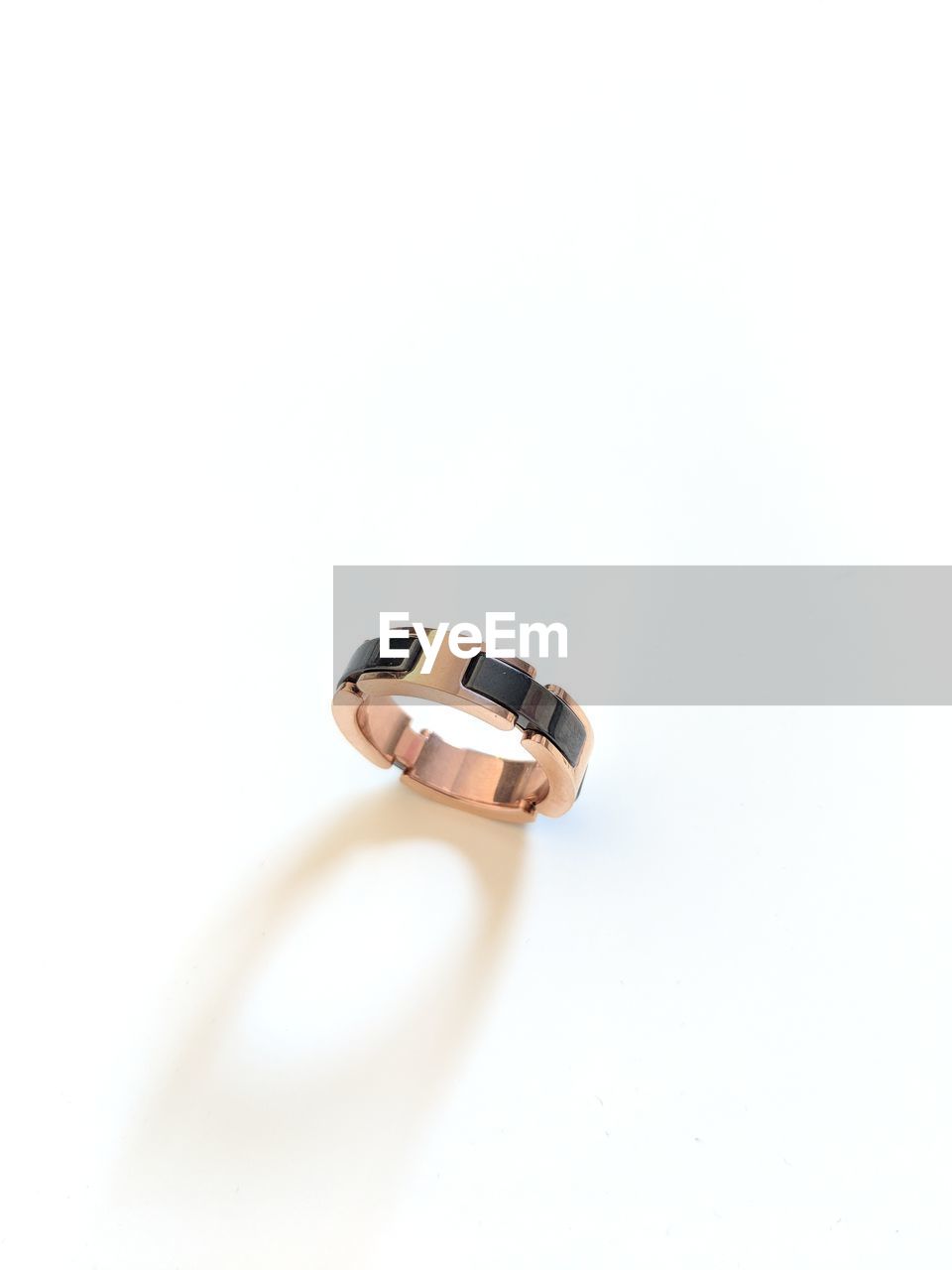 Close-up of ring over white background