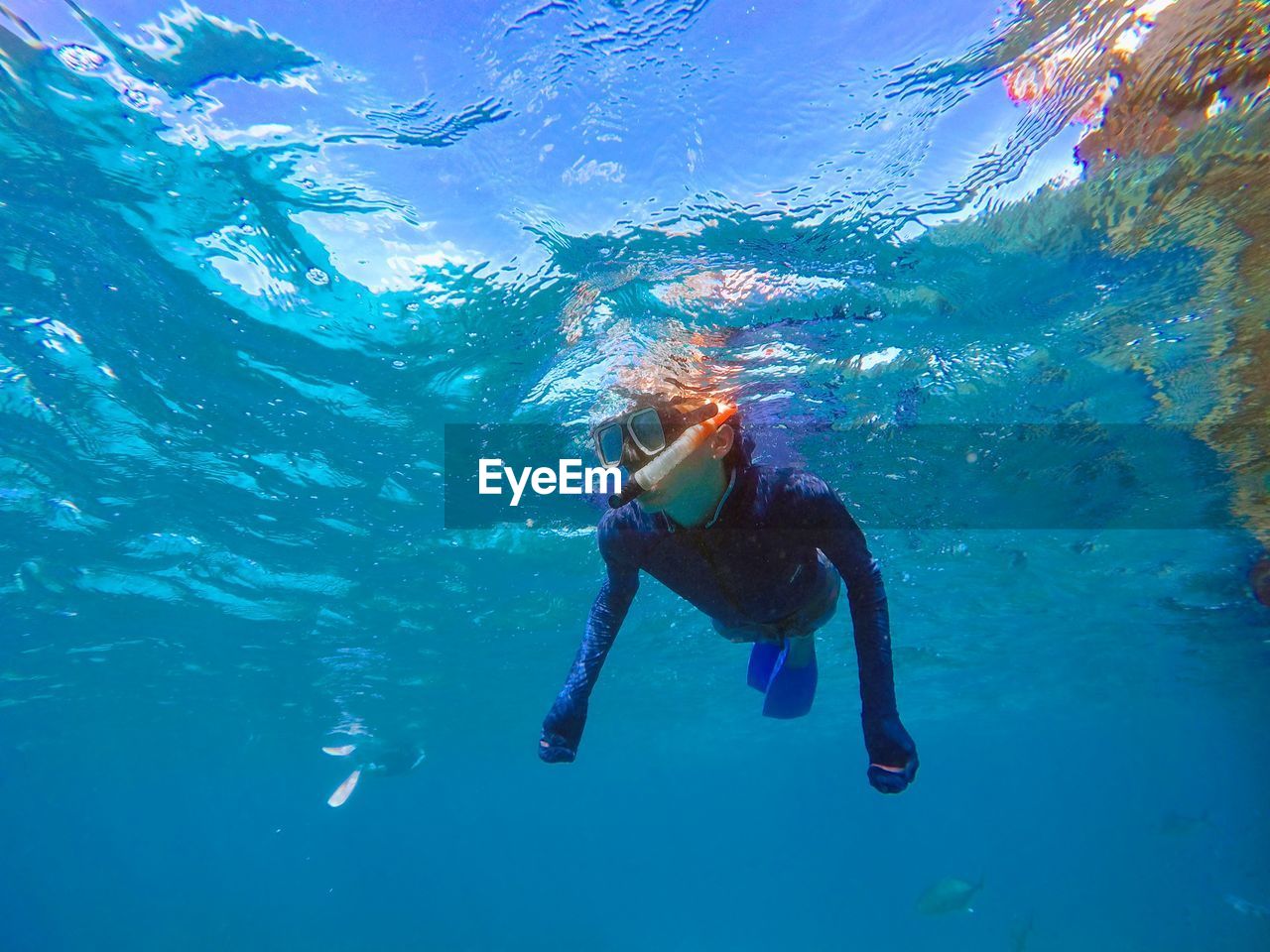 Boy swimming in sea