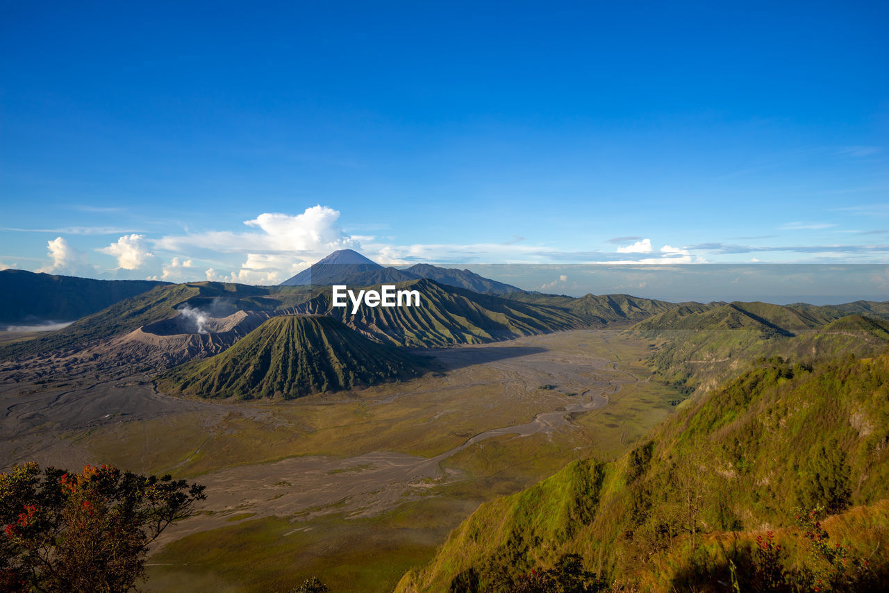 Beautiful view landscape of active volcano crater with smoke at mt. bromo, east java, indonesia.