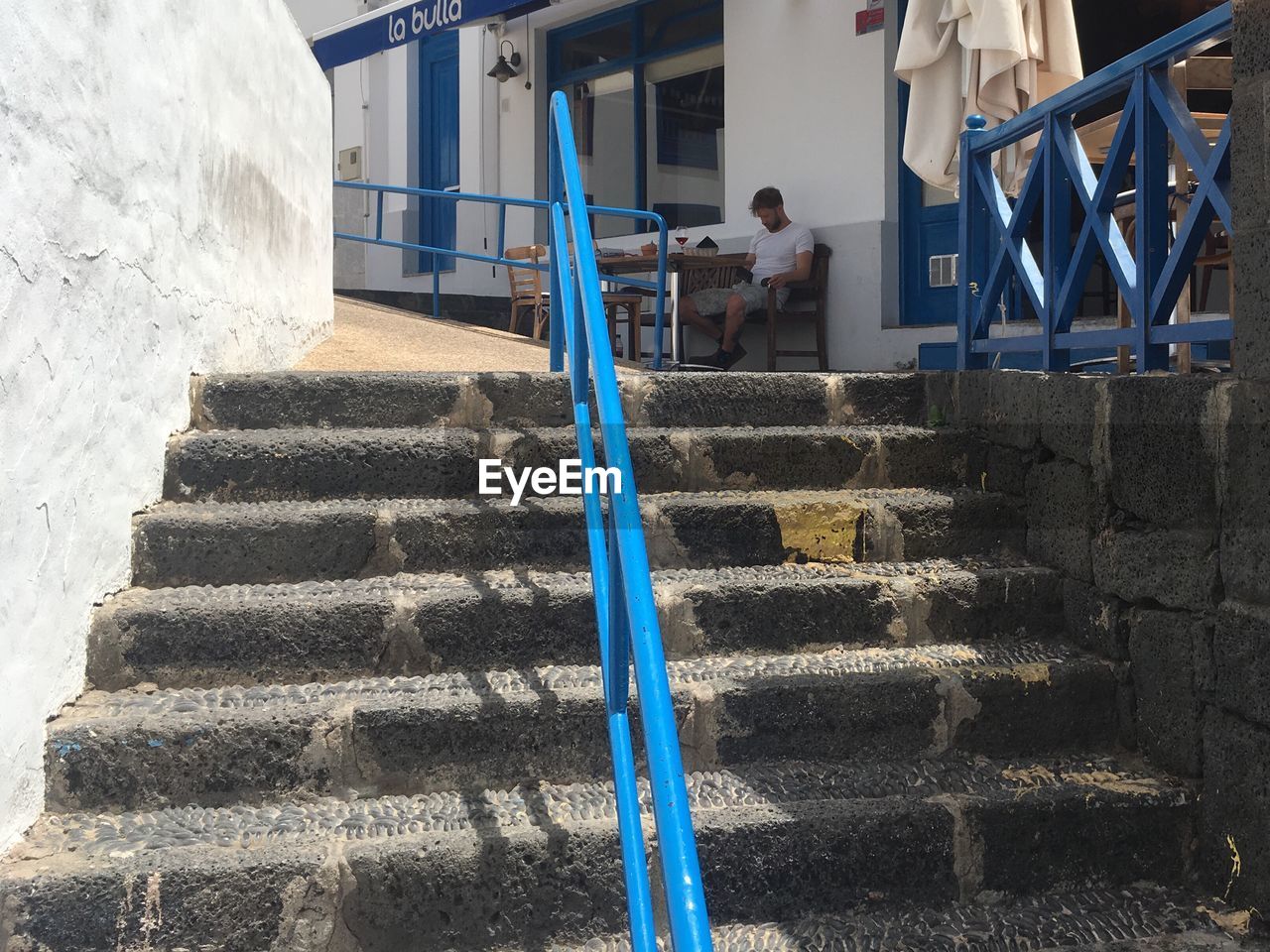 MAN STANDING ON STEPS