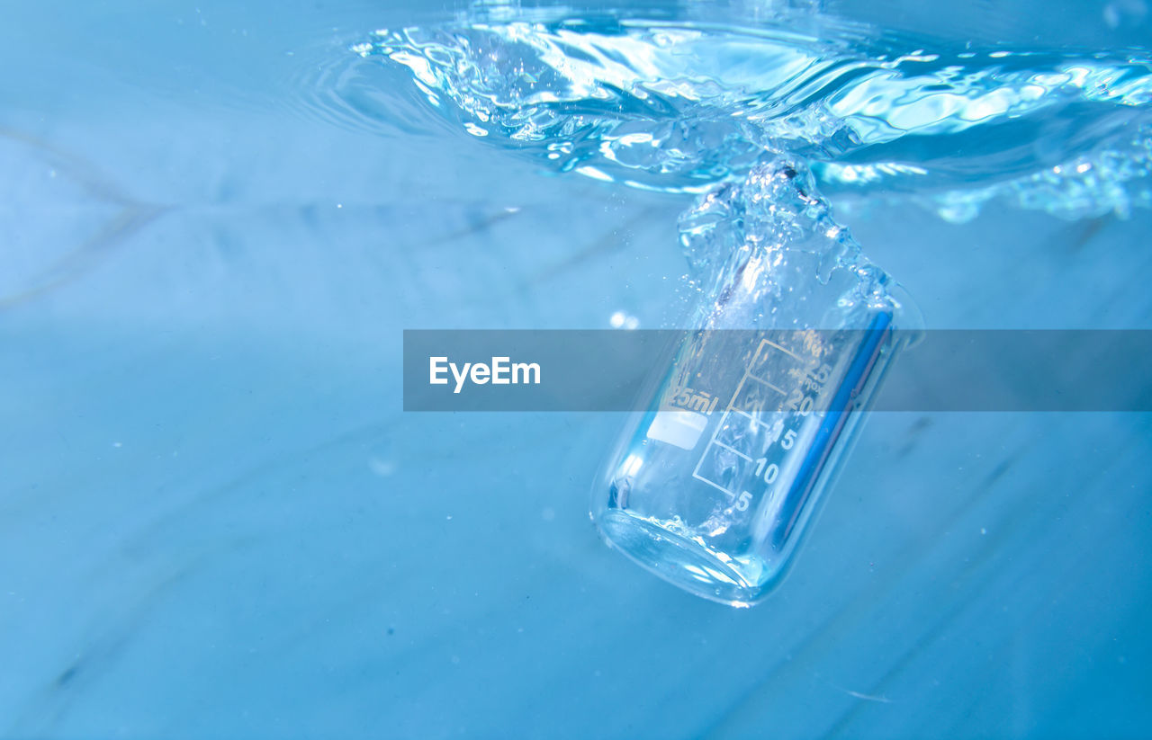 HIGH ANGLE VIEW OF SWIMMING POOL AT SEA