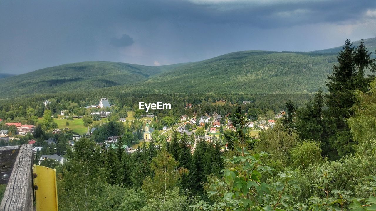 Scenic view of green mountains against sky