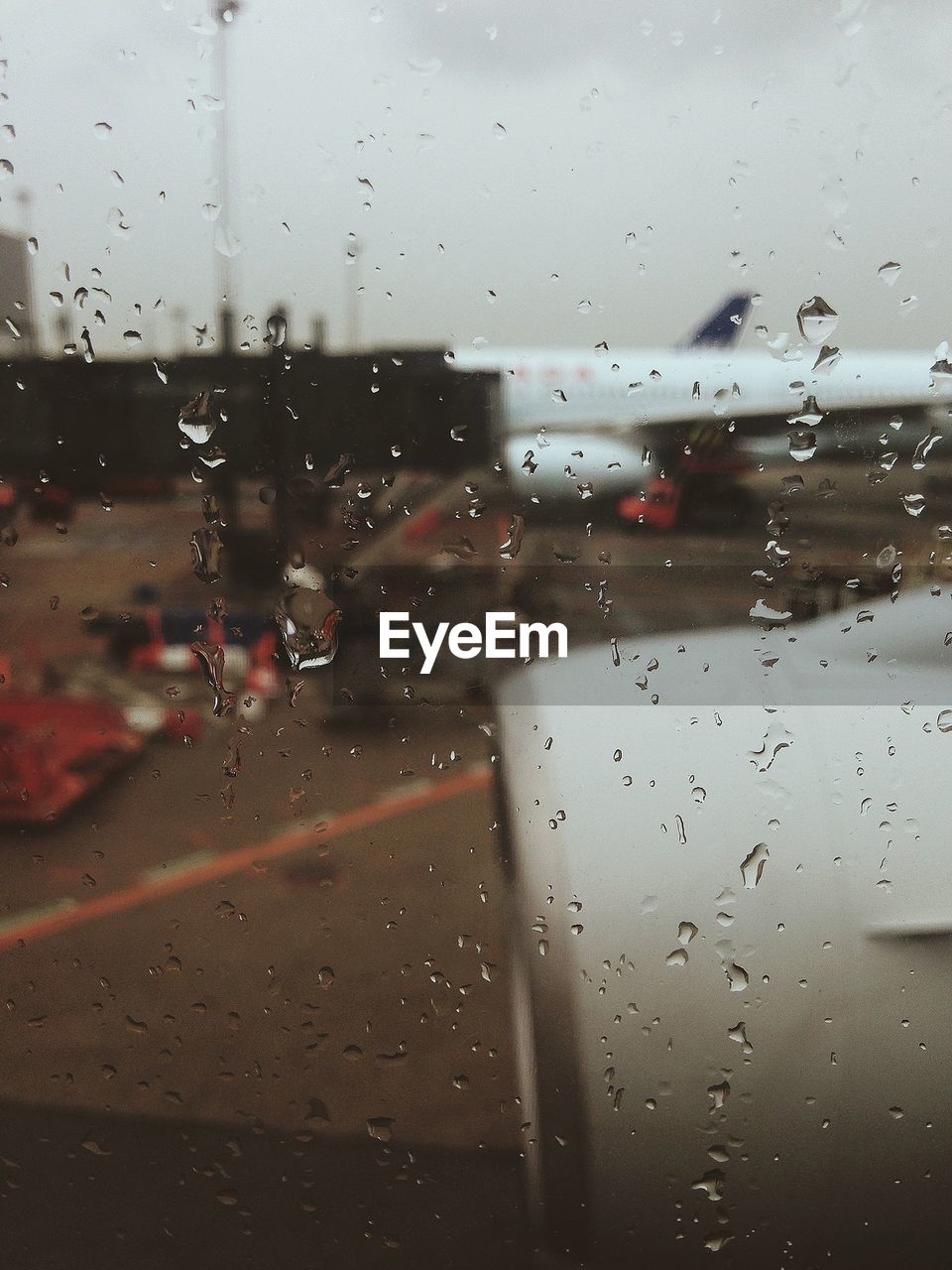 Airport seen through wet glass