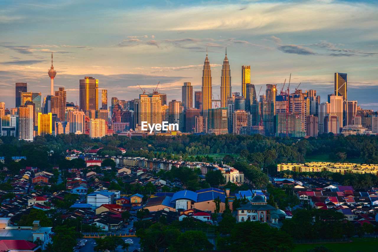 MODERN BUILDINGS IN CITY AGAINST SKY