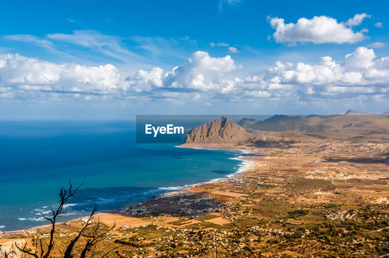 Scenic view of landscape and sea against sky
