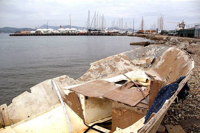 BOATS MOORED IN HARBOR