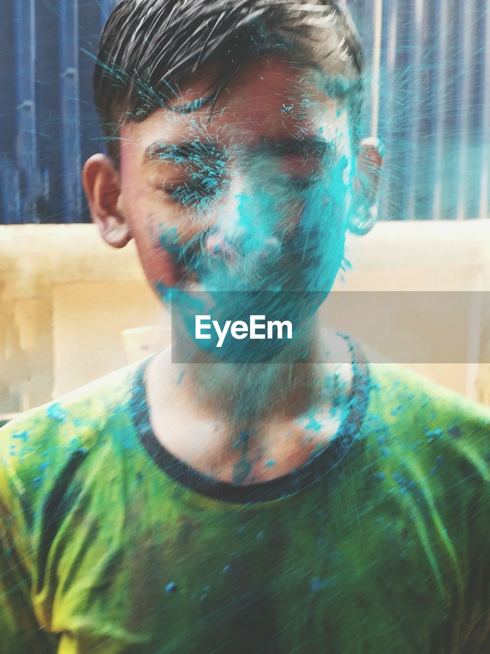 Close-up of boy with powder paint during holi celebration