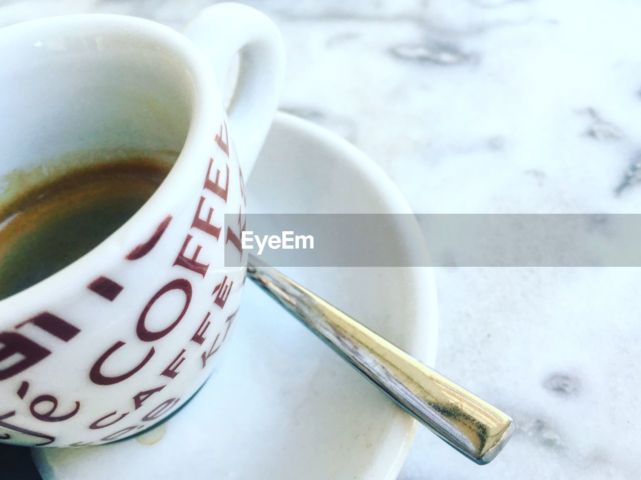 CLOSE-UP OF COFFEE CUP WITH COFFEE CUP