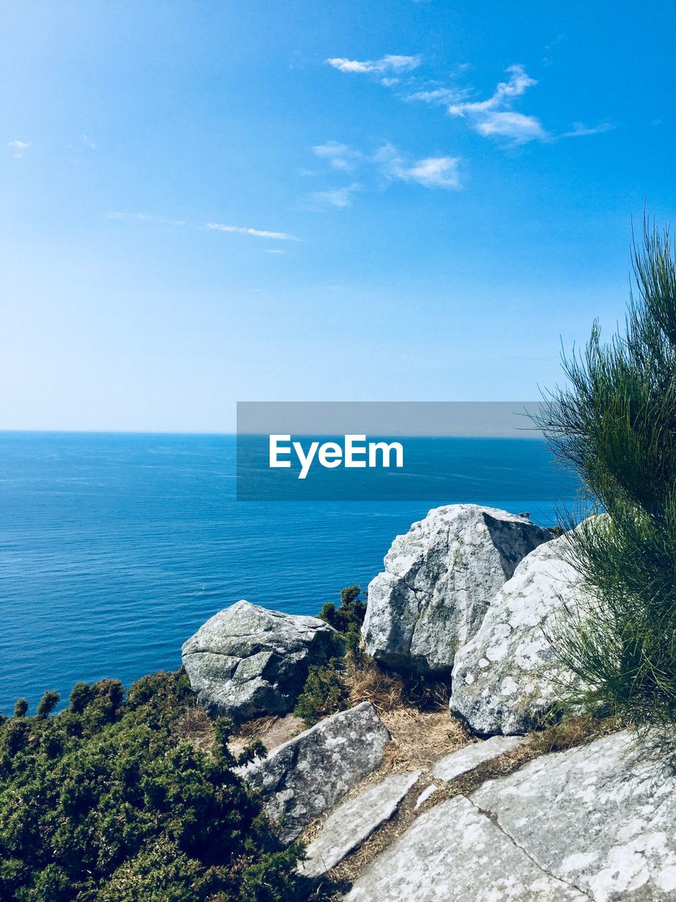 Scenic view of sea against blue sky