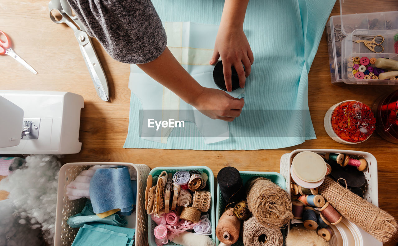 Directly above shot of woman doing needlework