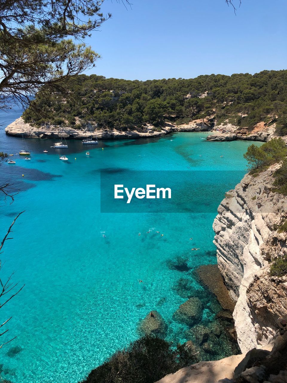 Scenic view of sea against clear blue sky