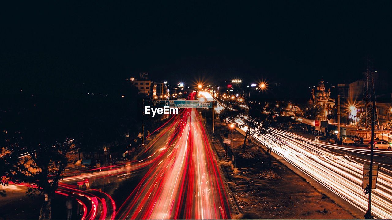 High angle view of light trails on road at night