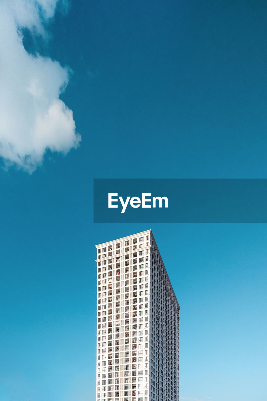 Low angle view of building against blue sky