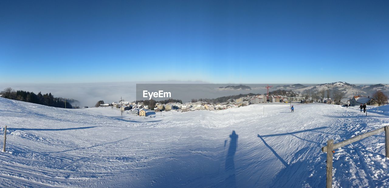 Scenic view of landscape against clear blue sky
