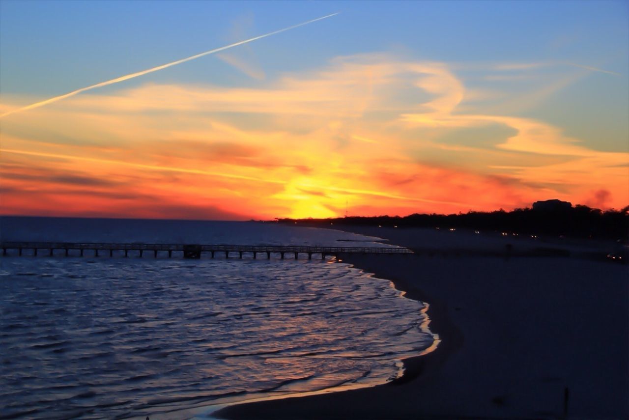 SCENIC VIEW OF SUNSET OVER SEA