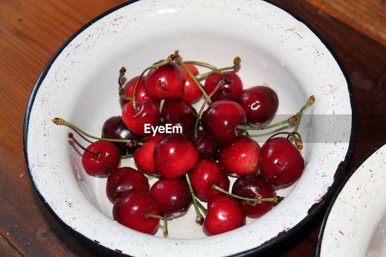 food and drink, food, healthy eating, freshness, fruit, wellbeing, plant, produce, red, cherry, plate, wood, table, no people, bowl, indoors, still life, vegetable, organic, high angle view, directly above, dish