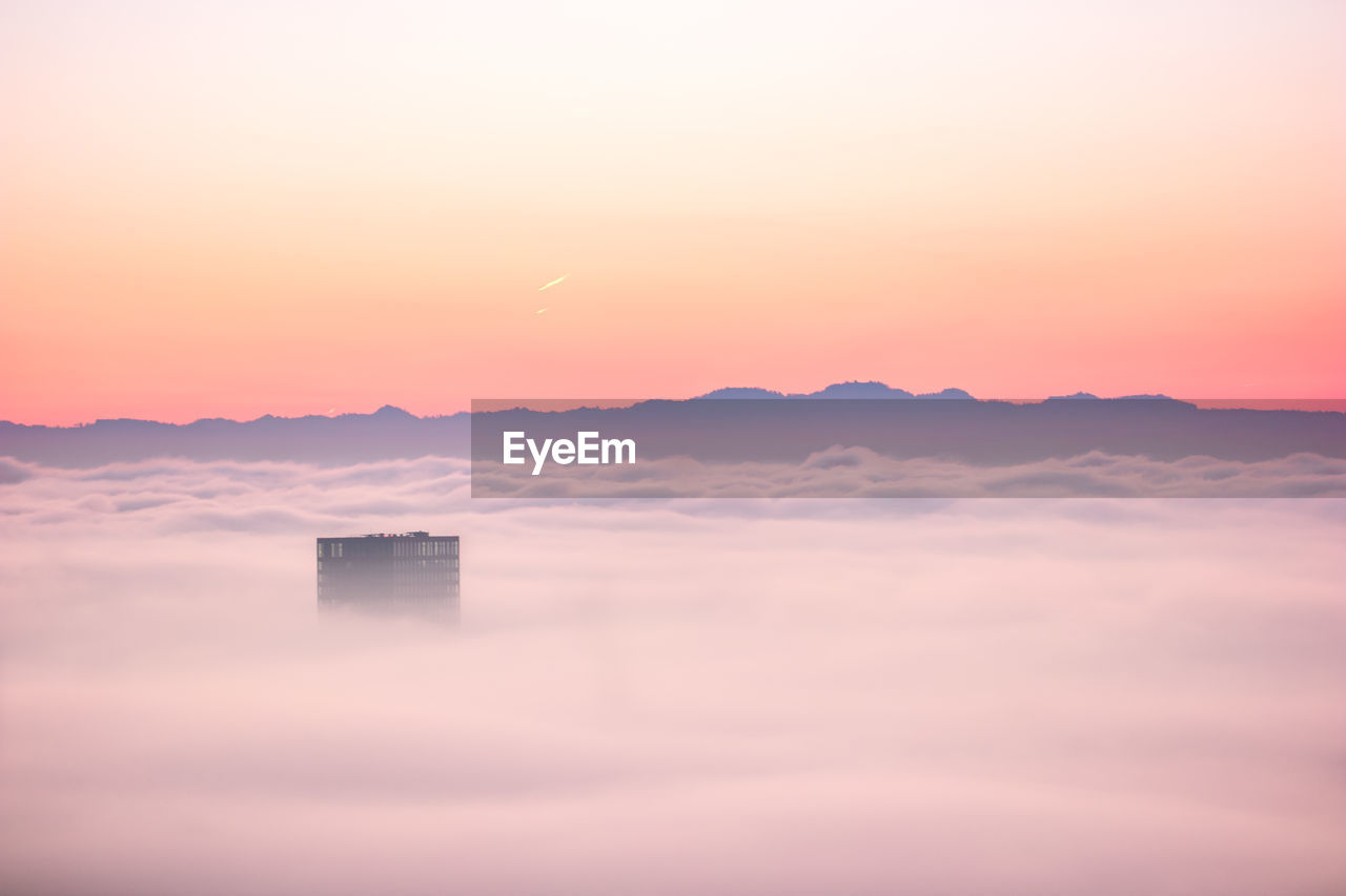 Scenic view of mountains against sky during sunset