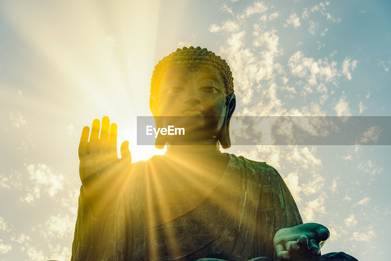 Low angle view of statue against sky