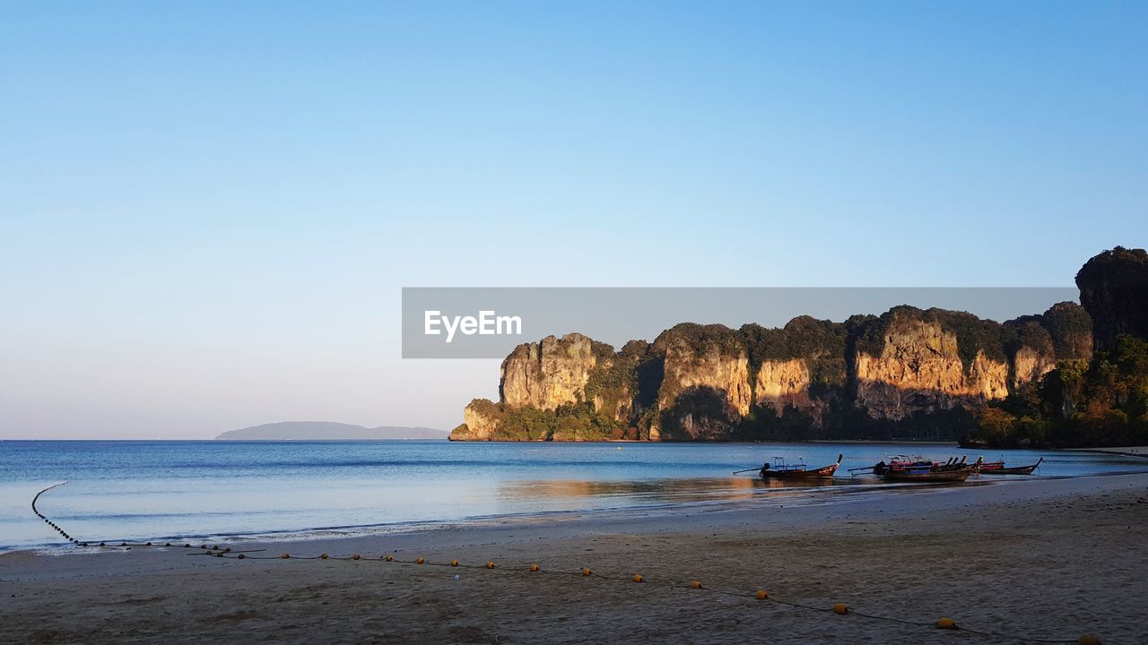 Scenic view of beach against clear sky