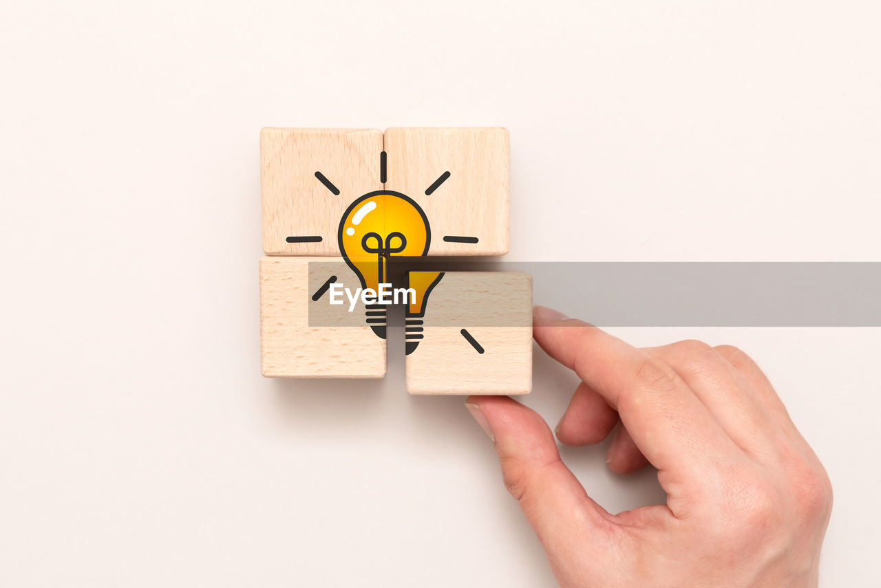 hand, one person, indoors, cartoon, creativity, holding, studio shot, adult, business, communication, men, copy space