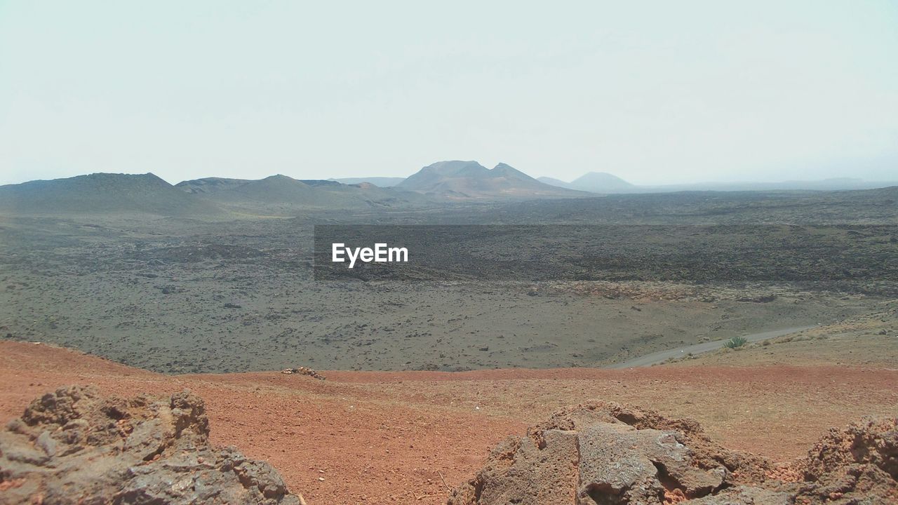 Scenic view of desert against clear sky