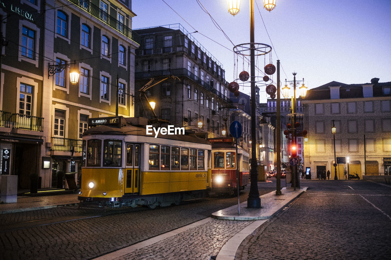 ILLUMINATED STREET LIGHTS AT NIGHT