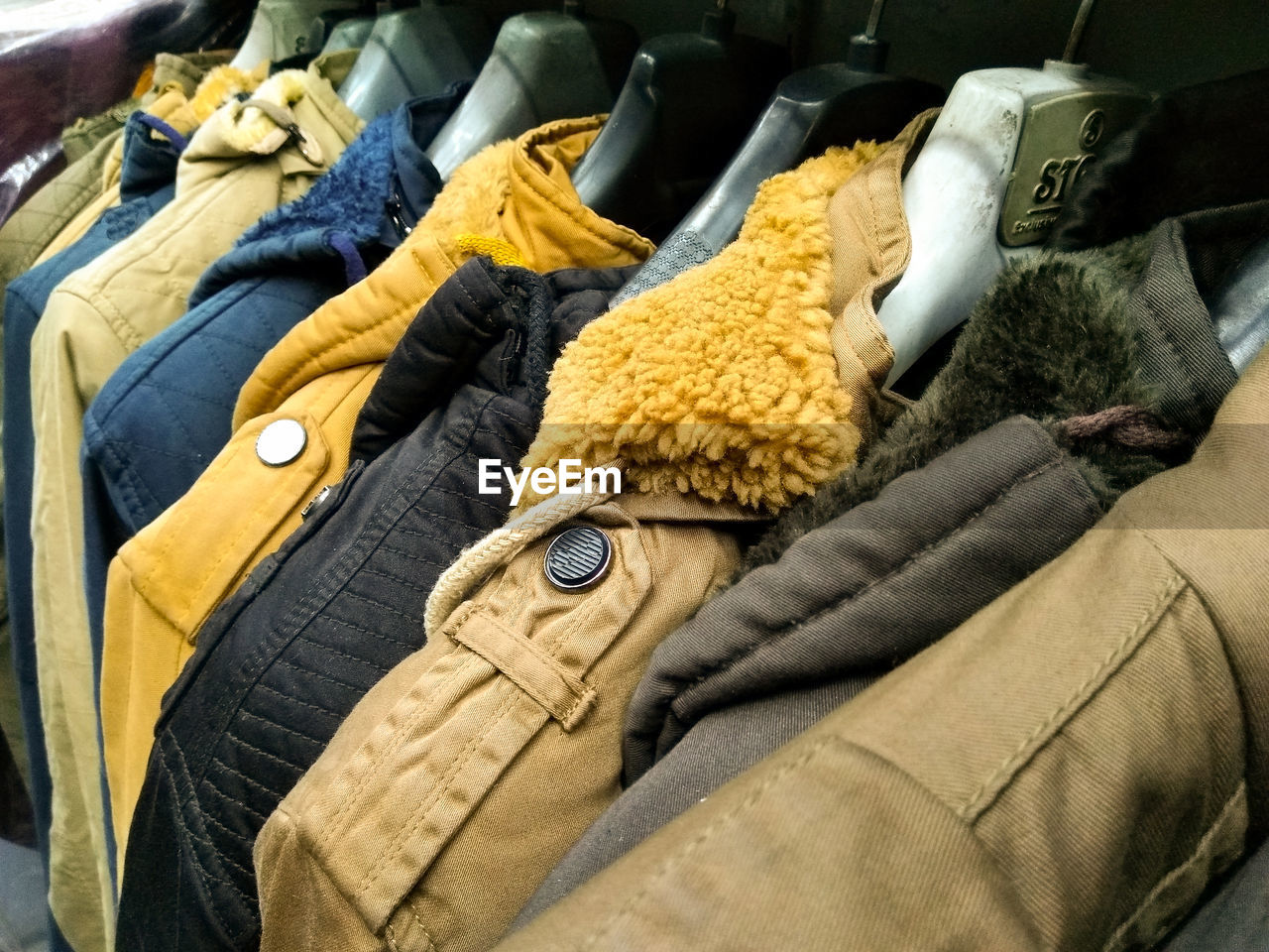 High angle view of clothes hanging on display at store