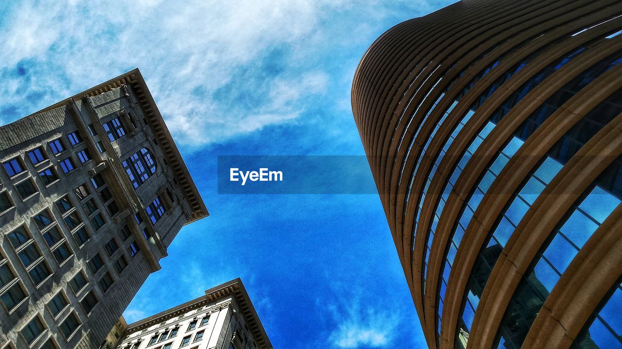 LOW ANGLE VIEW OF MODERN BUILDINGS AGAINST SKY