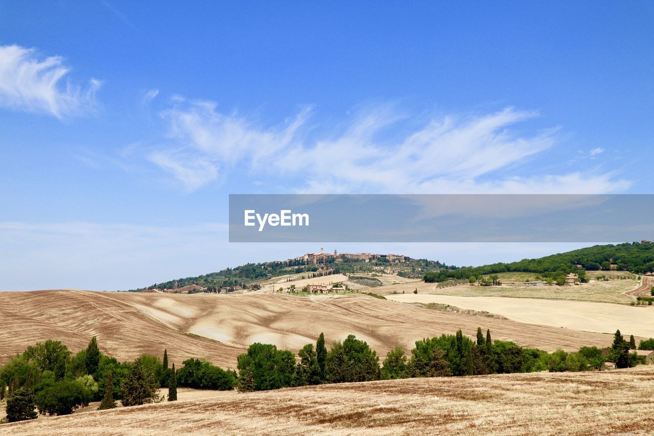 View of landscape against blue sky