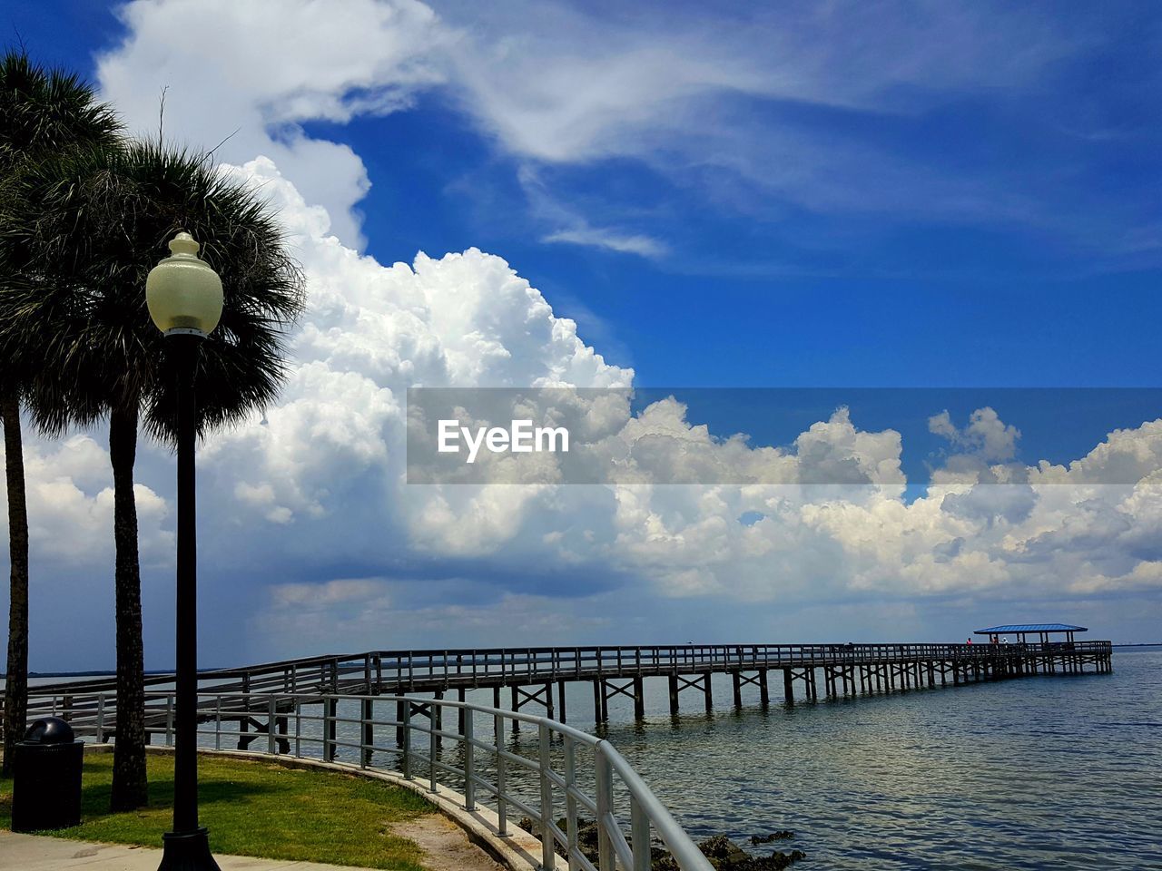 BUILT STRUCTURE BY SEA AGAINST SKY