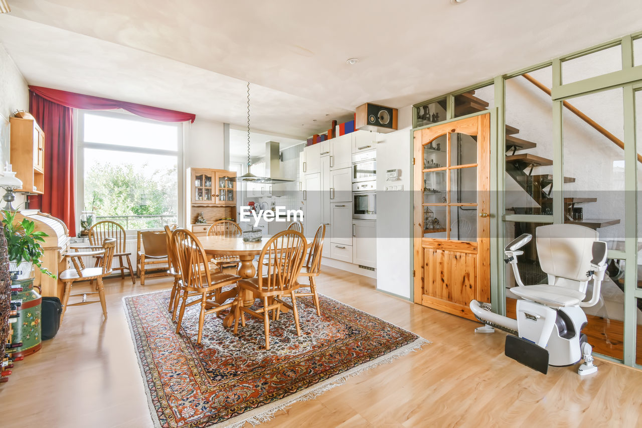 Dinning table and chairs in empty apartment