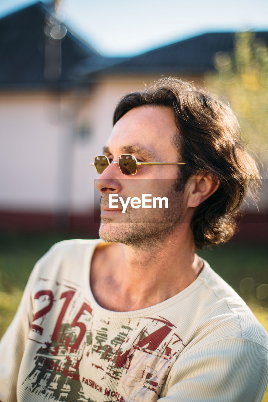 Close-up portrait of mature man with sunglasses