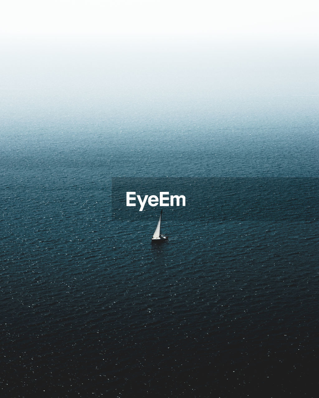 Aerial view of sailboat sailing in sea