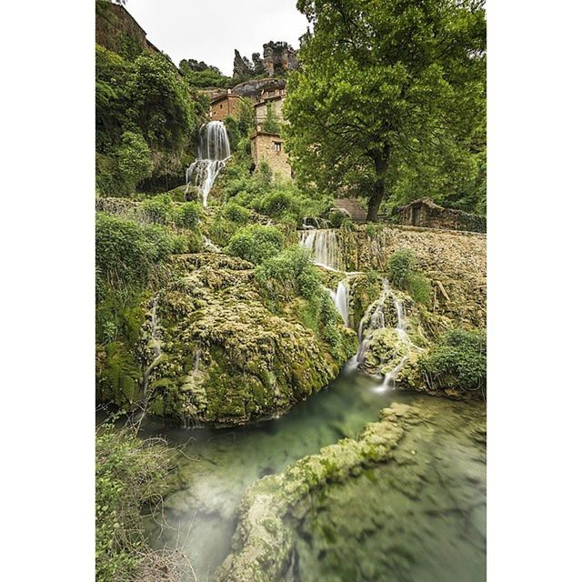 VIEW OF RIVER FLOWING THROUGH ROCKS