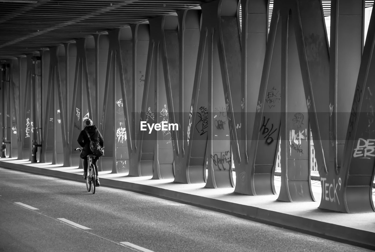 Woman cycling in the tunnel