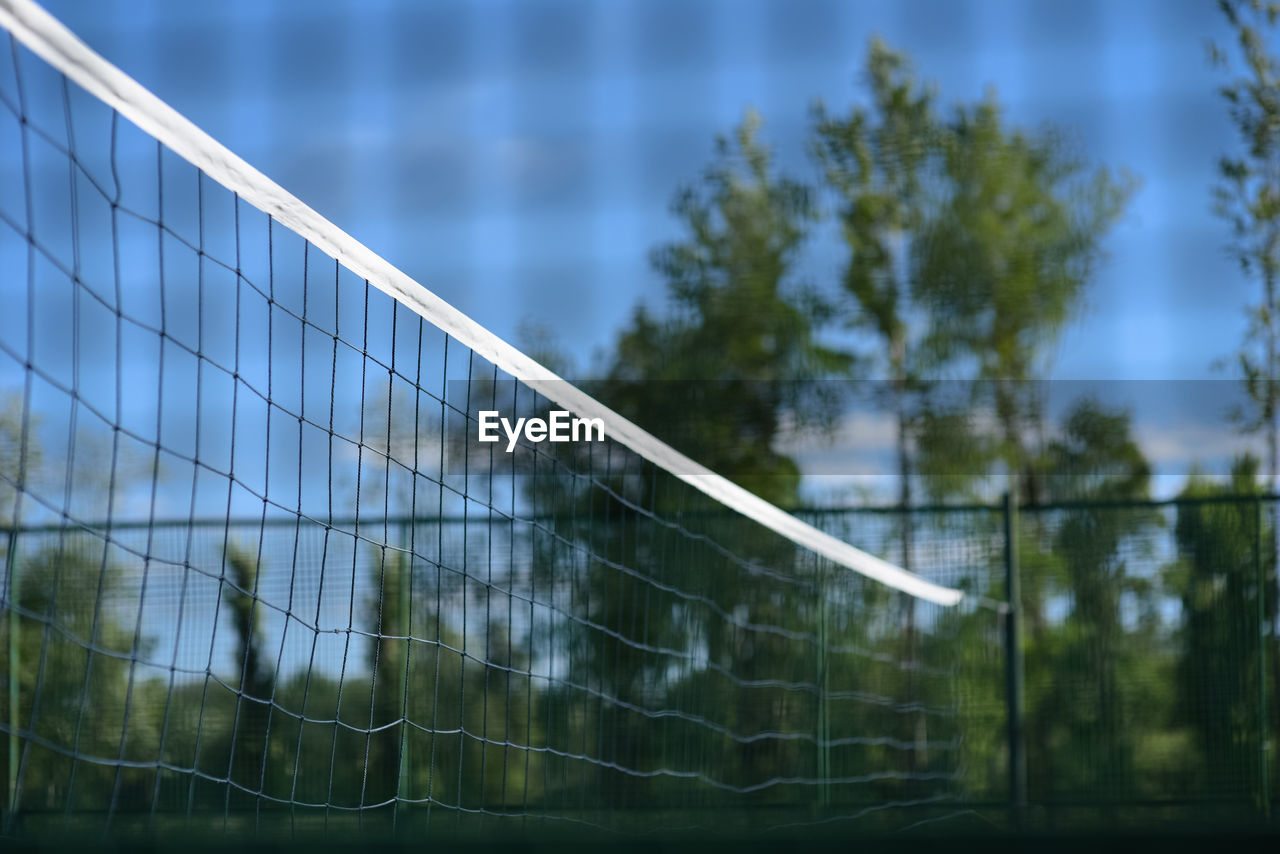 LOW ANGLE VIEW OF FENCE AGAINST PLANTS