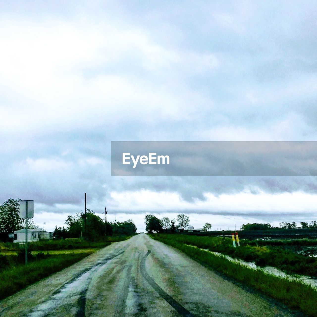 ROAD BY LANDSCAPE AGAINST SKY