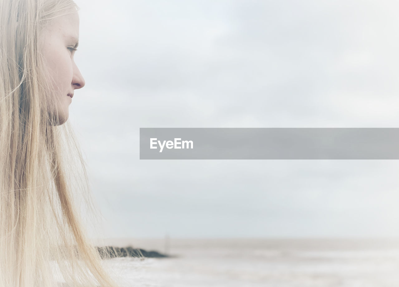 Close-up of woman looking at sea