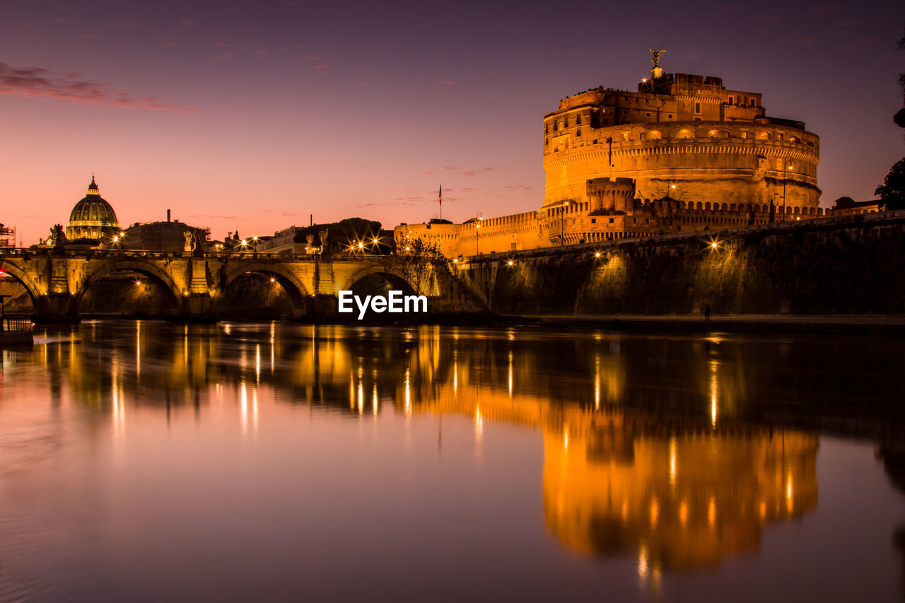 REFLECTION OF ILLUMINATED BUILDINGS IN WATER