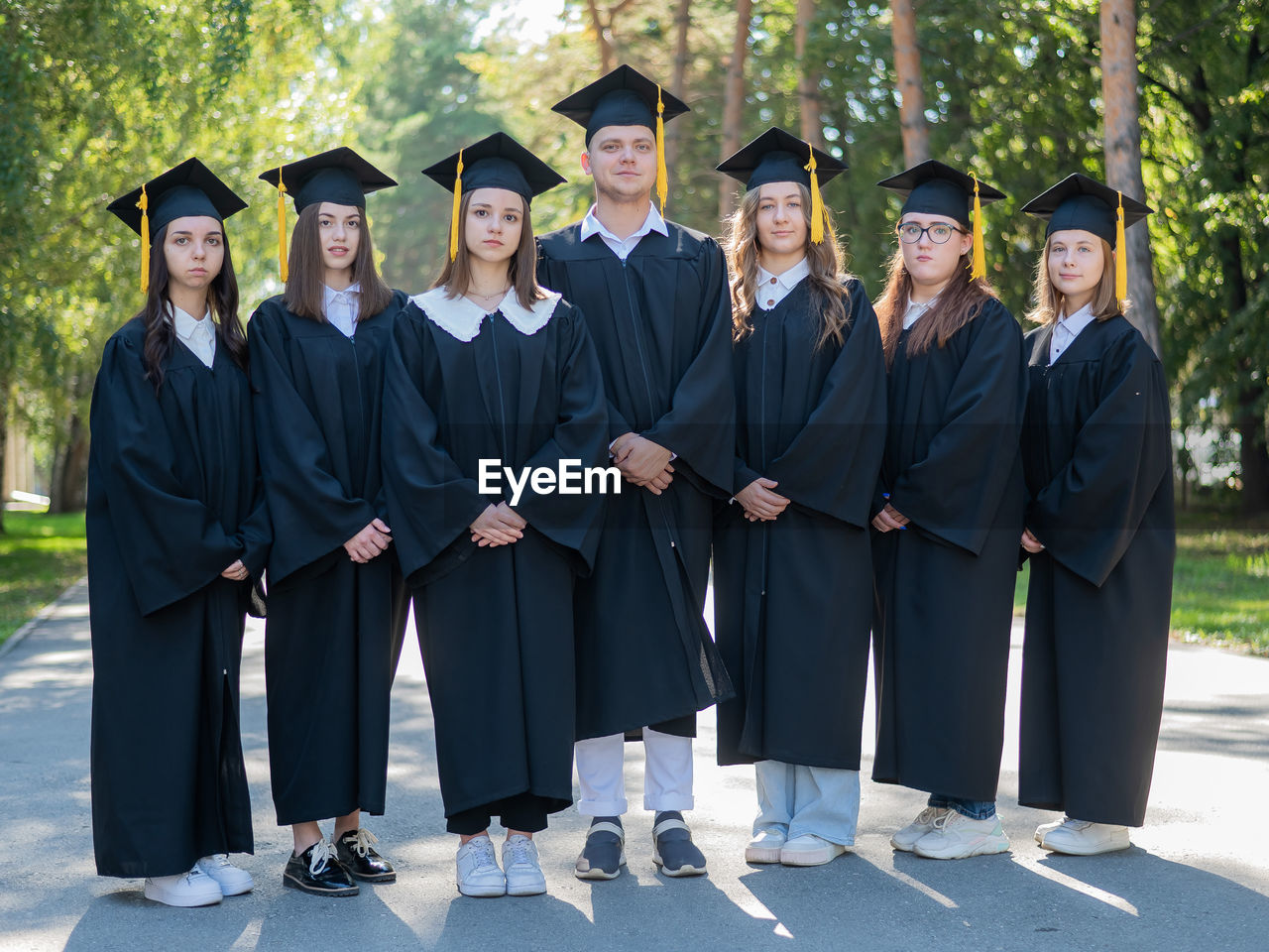 portrait of woman wearing graduation gown