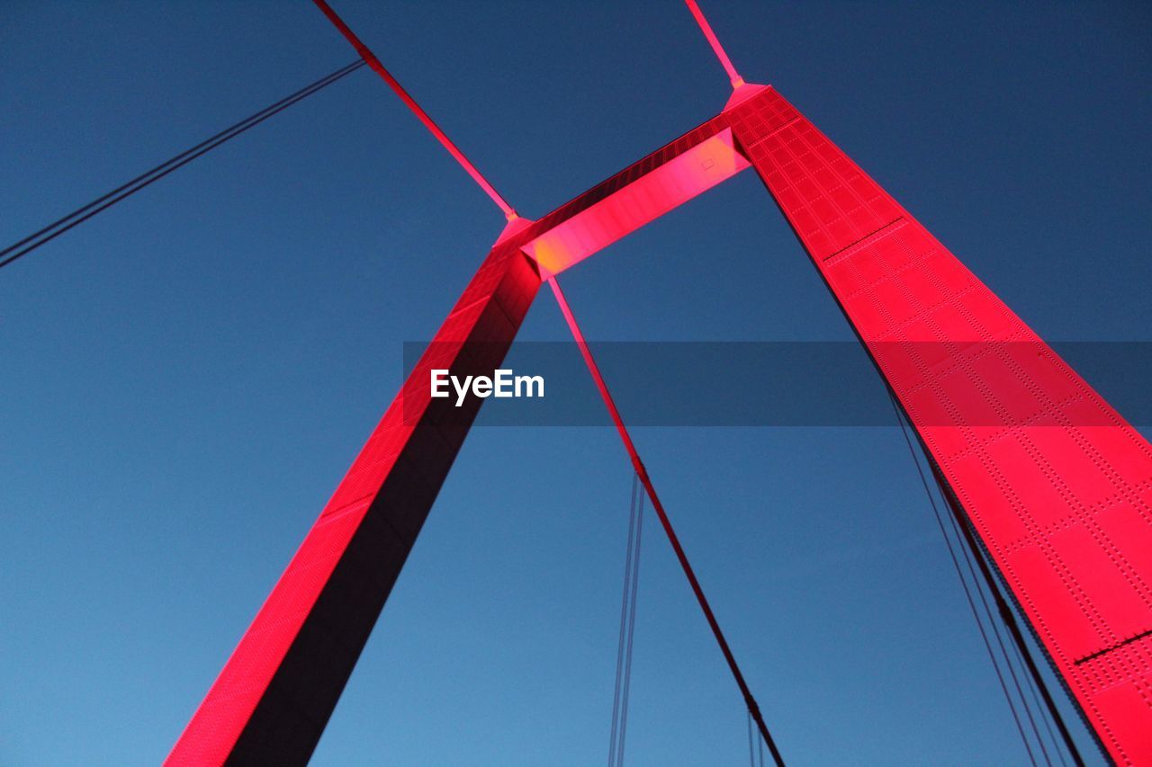 low angle view of bridge against blue sky