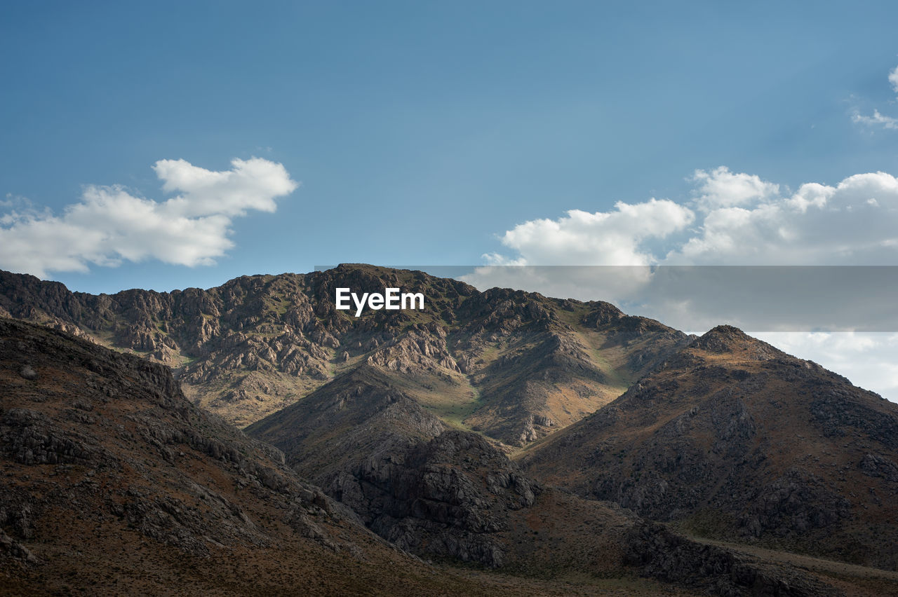 Rocky mountains with foliage and cloudy sky, rocky mountain khuzestan province, iran