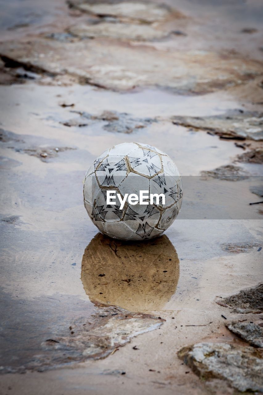 CLOSE-UP OF BALL ON BEACH