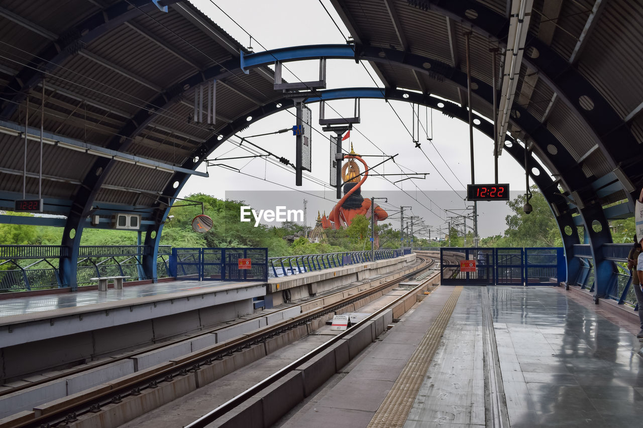 Delhi metro train arriving at jhandewalan metro station in new delhi, india, asia, public metro